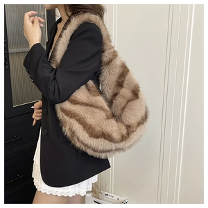 Detailed view of striped faux fur tote bag showing plush texture and brown color patterns