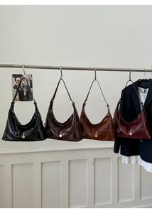 Hobo bags in four colors with glossy wrinkled texture and front zipper metal details