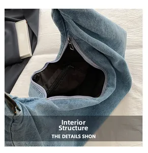 Detail showing the inner lining with a zipper pocket of the denim shoulder bag