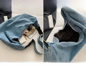 Detailed internal storage of blue denim tote bag showing spacious main compartment