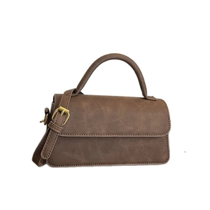 Sac bandoulière marron vintage avec poignée ronde et design rectangulaire minimaliste