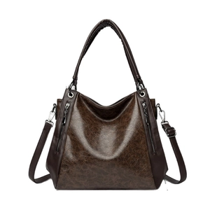 Large vintage brown faux leather tote bag for women with dual handles and crossbody strap