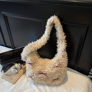 Fluffy beige underarm bag with red ribbon bows and golden beads for autumn winter