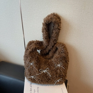 Brown faux fur underarm bag with silver bow heart charms and soft plush texture