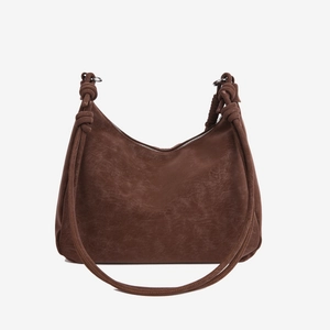 Brown matte leather hobo bag with vintage texture and decorative knot shoulder strap