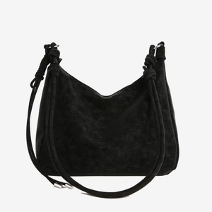 Minimalist black large capacity shoulder bag with unique knot detail on the straps