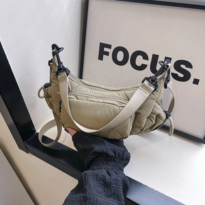 Versatile multi-pocket nylon armpit bag in khaki with wide strap and ruched details