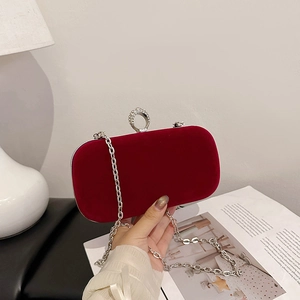 Elegant red velvet evening clutch bag with sparkling rhinestone ring clasp and silver chain