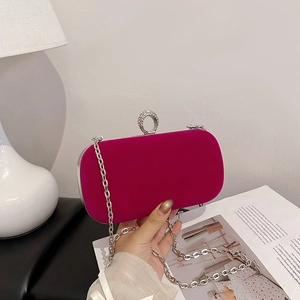 Fuchsia velvet evening clutch with silver frame and crystal ring closure for women