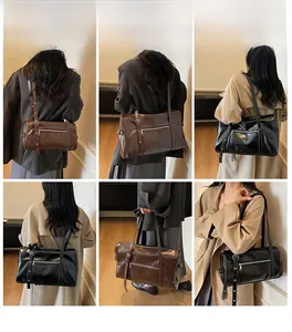 Detail shots of minimalist Boston bag in black and dark brown with adjustable straps