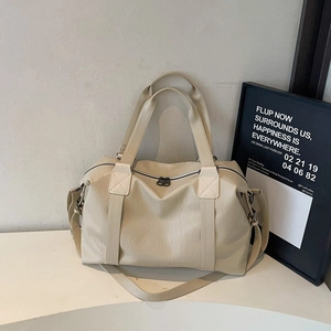 Minimalist off-white pebbled PU leather travel handbag with adjustable shoulder straps