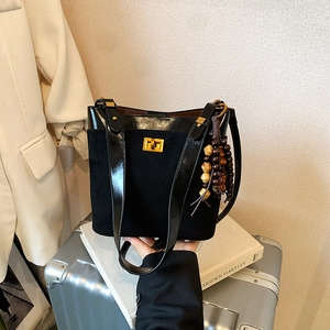 Black large capacity shoulder bag with gold square buckle and wooden bead charm