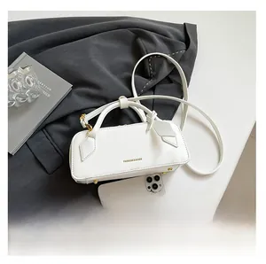 White baguette bag with 'FASHION & BAGS' text and phone for size reference