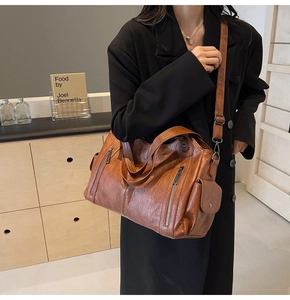 Close-up of retro brown lychee grain PU leather tote bag with functional pockets