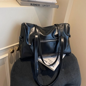 Classic black Boston shoulder bag with silver zippers and large capacity design
