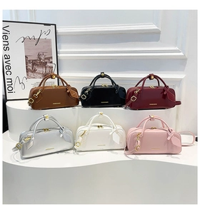 Six different colors of minimalist fashion handbags displayed on a white step stand