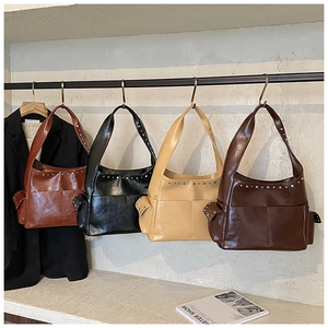 Four vintage shoulder bags with silver studs in reddish-brown, black, beige, and dark coffee