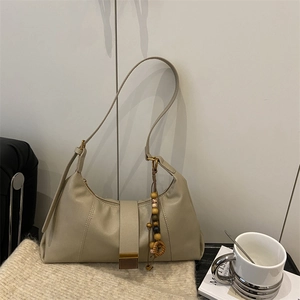 Minimalist beige PU leather shoulder bag with buckle strap and wooden bead accessory