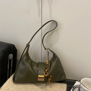 Olive green half-moon leather shoulder bag with gold metal buckle and wooden bead charm