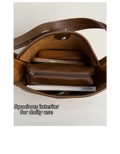 Interior view of brown faux leather tote showing spacious storage for daily essentials
