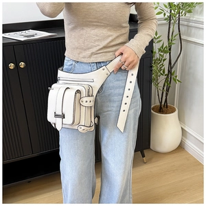 Detail of off-white lychee pattern leather waist bag with silver rivets and zippers