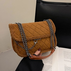Brown quilted shoulder bag with faux shearling trim and silver chain strap for autumn