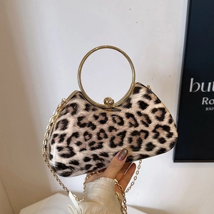 Leopard print clutch bag with gold round handle and chain strap for evening wear