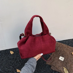 Burgundy pleated cloud bag in faux suede with gold hardware and shoulder strap