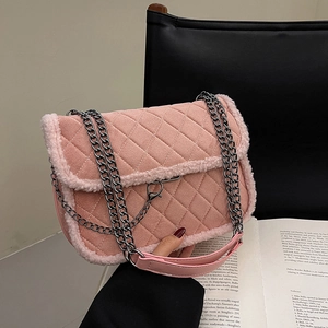 Pink quilted lamb hair shoulder bag with silver chain strap and faux fur trim details