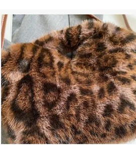 Close-up of leopard print faux fur texture on a shoulder bag with soft plush finish