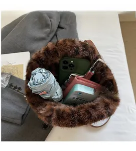 Interior view showing the large capacity of this brown faux fur bucket bag
