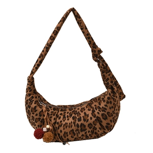 Suede leopard print crescent bag with colorful pompom charm and metal zipper