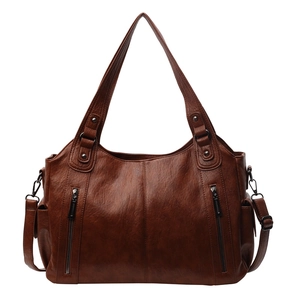 Vintage brown lychee textured tote bag with multi-pocket design and adjustable shoulder strap