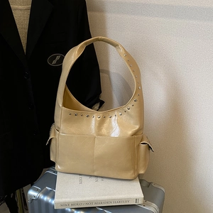Beige faux leather shoulder bag with silver rivets and side pockets for casual 2025 fashion
