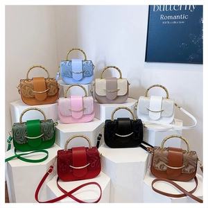 Detailed set of mini leather crossbody bags with golden spiral handles in 9 trendy colors
