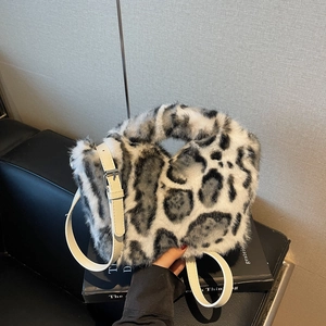 Chic faux fur leopard print handbag with adjustable strap for versatile crossbody wear
