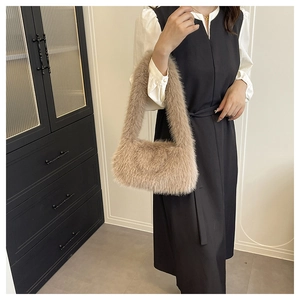 Close-up detail of plush camel faux fur handbag with high-quality soft fluffy texture