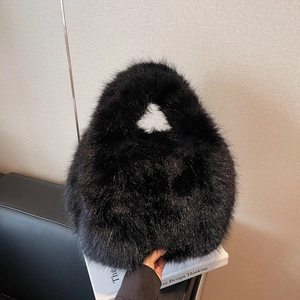 Large black faux fur plush handbag for women featuring a minimalist rounded arc design