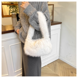 Detailed close-up of soft white plush handbag texture and integrated top handle design