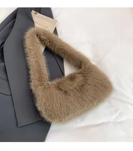 Close-up of brown faux fur handbag texture with minimalist round shoulder bag design