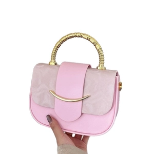 Chic pink vintage square box bag with woven texture lid and golden spiral handle