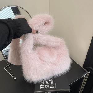 Pink faux fur handbag for women, fluffy plush shoulder bag with minimalist top handle design