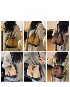 Detail view of quilted bucket bags in various colors with drawstring and chain strap