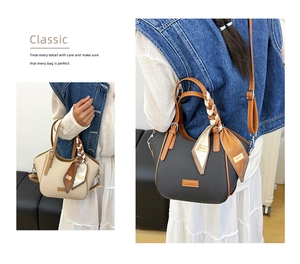 Detail of woven textured handbags in cream and grey with decorative silk scarf handles