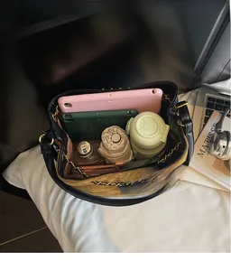 Internal view of a spacious color-block bucket bag showing daily essentials storage