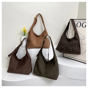 Hobo shoulder bags in suede finishes featuring brown tones and chic leopard patterns