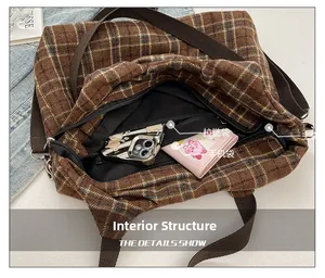 Detailed interior of the brown checkered tote showing zipper pocket and phone compartment