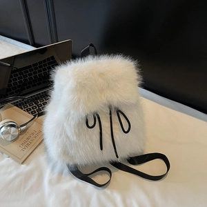 White faux fur backpack with black nylon straps and drawstring for modern girl's daily use