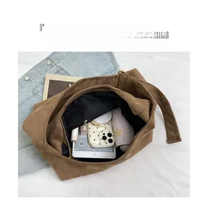Interior view of brown leopard suede tote bag showing large capacity and organized compartments