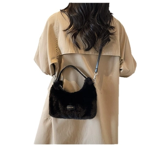Chic black faux fur crescent handbag with leather handle for 2025 autumn fashion style